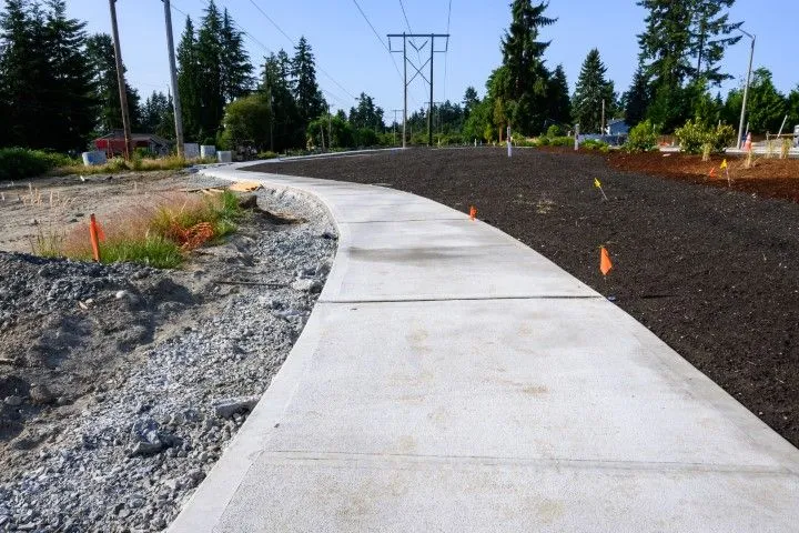New concrete sidewalk construction along residential street in Grandview, MO